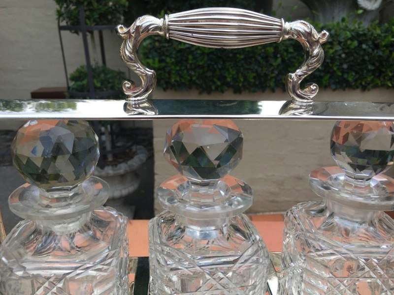A Early 20th Century Edwardian Silver Plated Tantalus Circa 1901 To 1914 With Cut-Glass 3 Decanters