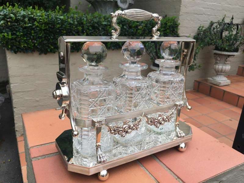 A Early 20th Century Edwardian Silver Plated Tantalus Circa 1901 To 1914 With Cut-Glass 3 Decanters