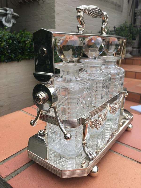 A Early 20th Century Edwardian Silver Plated Tantalus Circa 1901 To 1914 With Cut-Glass 3 Decanters