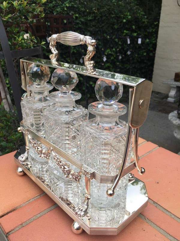 A Early 20th Century Edwardian Silver Plated Tantalus Circa 1901 To 1914 With Cut-Glass 3 Decanters