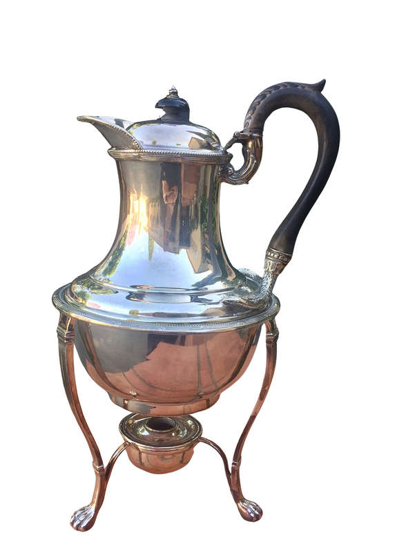 Silver plated tea kettle on stand