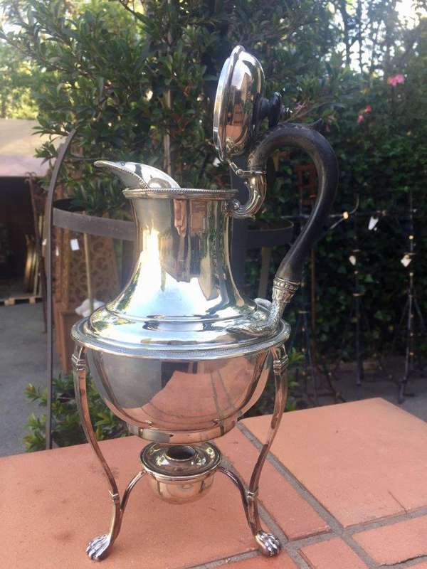 Silver plated tea kettle on stand
