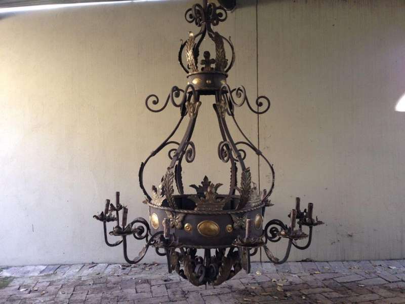 A Large Wrought Iron and Hand-Painted Imported Chandelier with Crown Detail