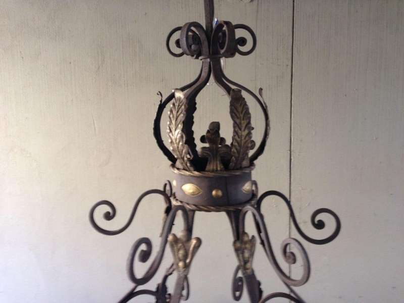 A Large Wrought Iron and Hand-Painted Imported Chandelier with Crown Detail