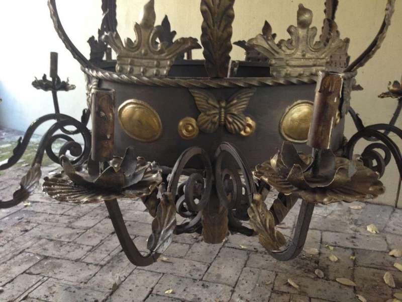 A Large Wrought Iron and Hand-Painted Imported Chandelier with Crown Detail