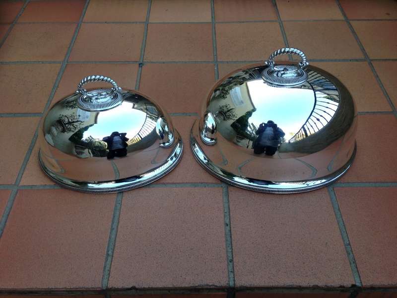 A Pair Of Graduated Silverplated Meat Domes By Walker & Hall   