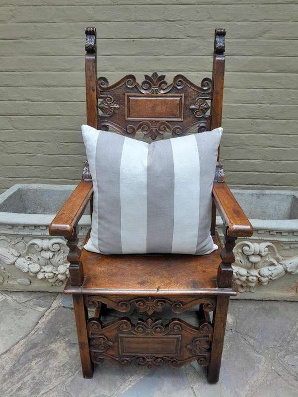 A Grey & White Stripped Cushion