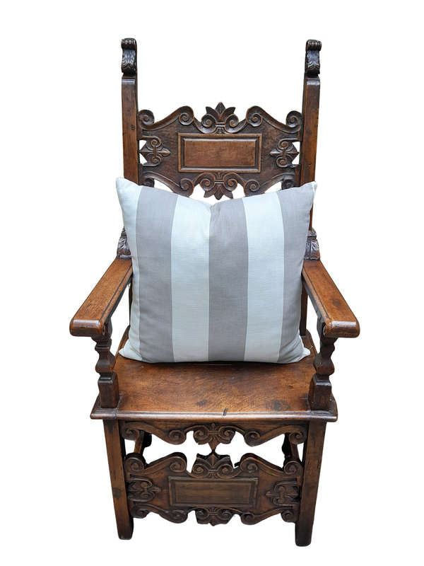 A Grey & White Stripped Cushion