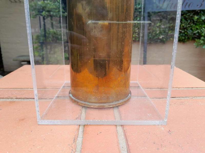A 20TH Century Brass Cannon Shell In A Custom-Made Display Perspex Box