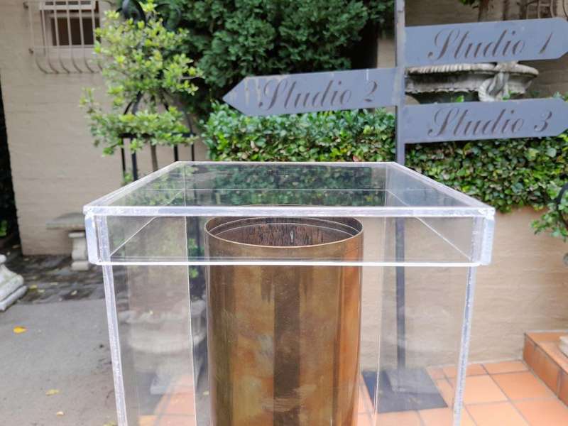 A 20TH Century Brass Cannon Shell In A Custom-Made Display Perspex Box