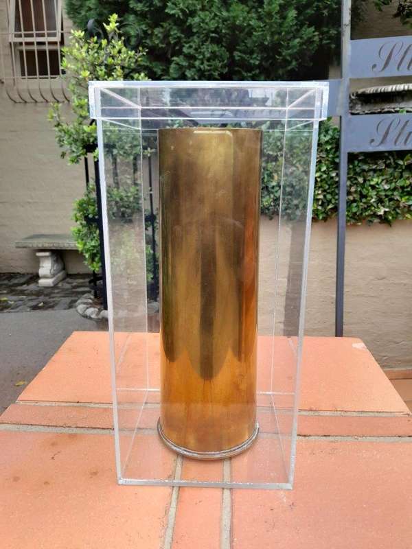 A 20TH Century Brass Cannon Shell In A Custom-Made Display Perspex Box