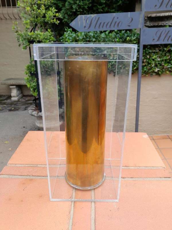 A 20TH Century Brass Cannon Shell In A Custom-Made Display Perspex Box