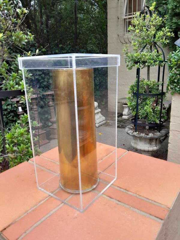 A 20TH Century Brass Cannon Shell In A Custom-Made Display Perspex Box
