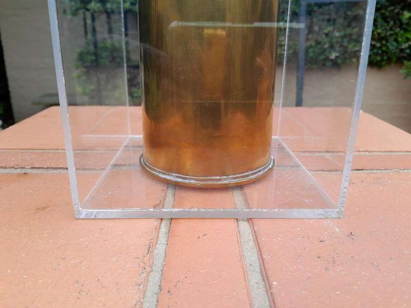 A 20TH Century Brass Cannon Shell In A Custom-Made Display Perspex Box