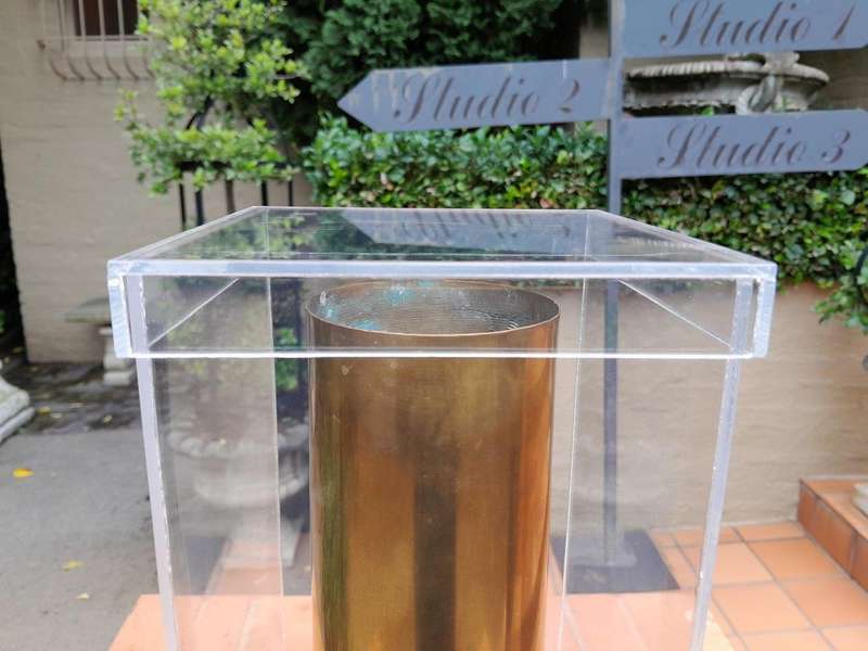 A 20TH Century Brass Cannon Shell In A Custom-Made Display Perspex Box
