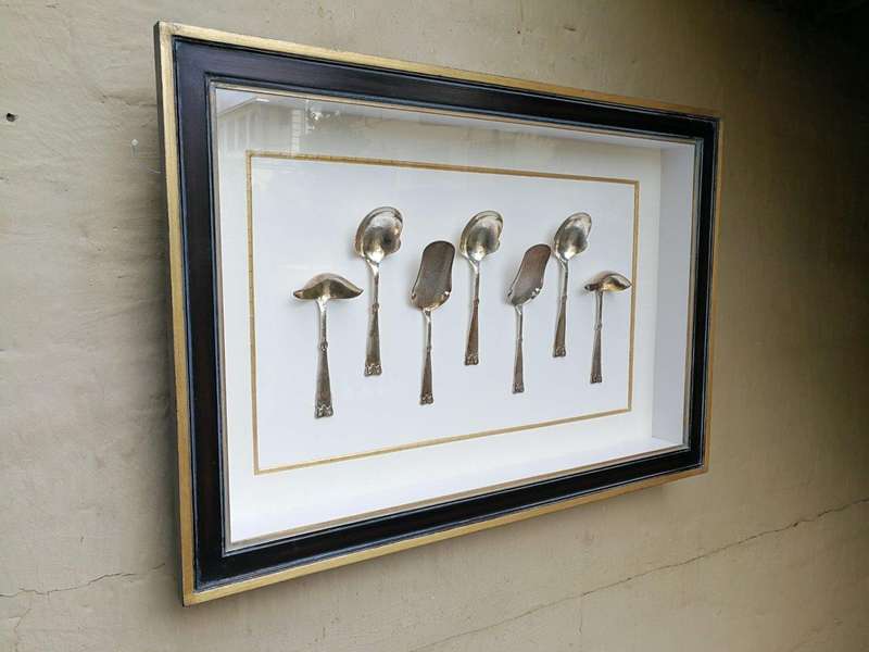 A Collection of Silver Plate Serving Flatware Framed in a Hand-made Frame