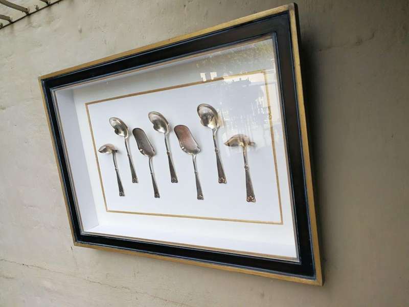 A Collection of Silver Plate Serving Flatware Framed in a Hand-made Frame