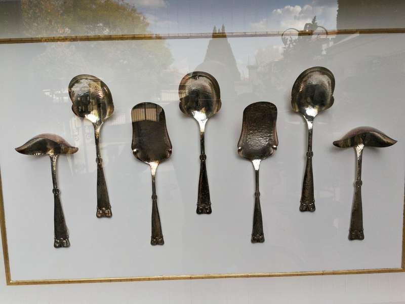 A Collection of Silver Plate Serving Flatware Framed in a Hand-made Frame