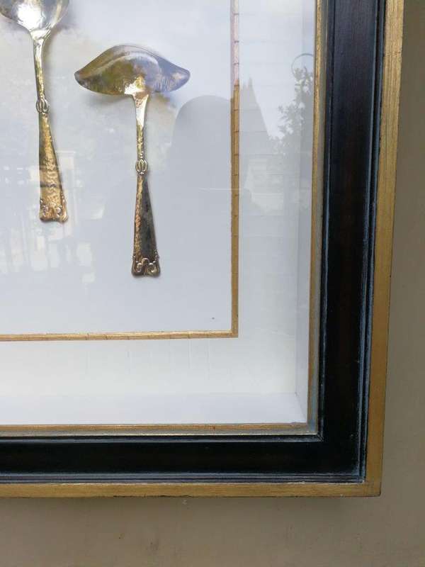 A Collection of Silver Plate Serving Flatware Framed in a Hand-made Frame