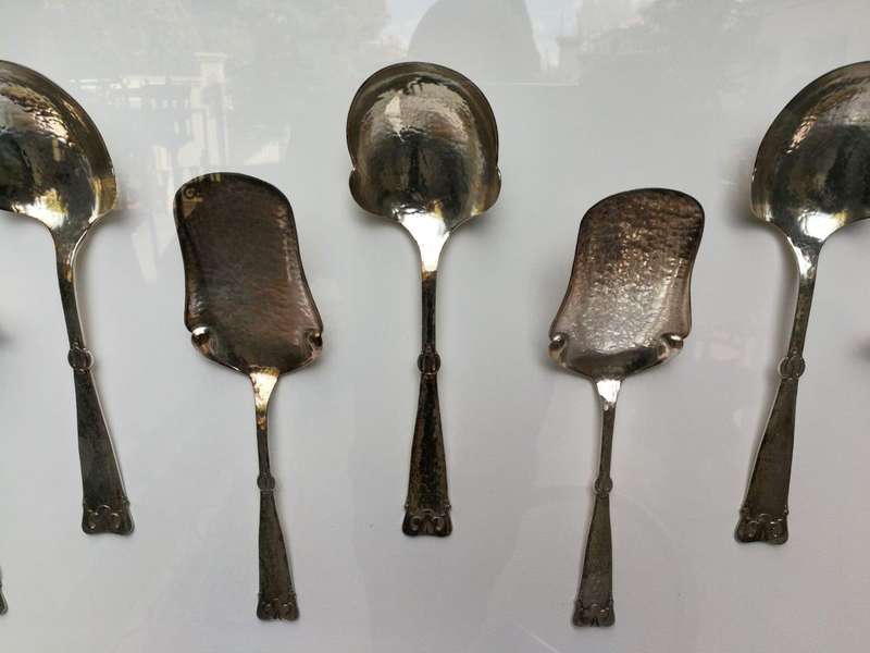 A Collection of Silver Plate Serving Flatware Framed in a Hand-made Frame