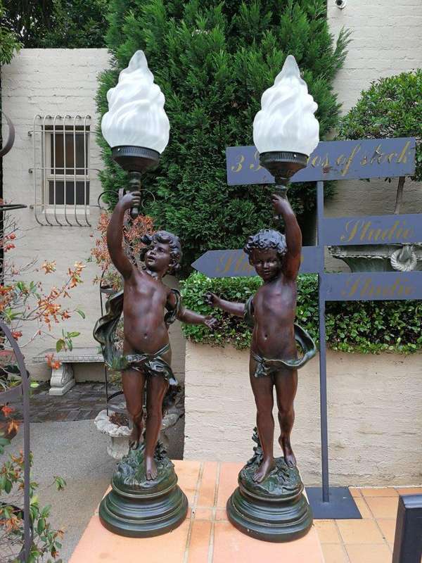 A Pair Of Antique Figural Lamps
