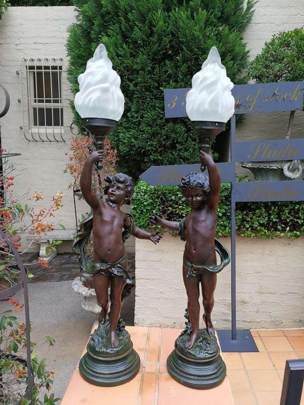 A Pair Of Antique Figural Lamps