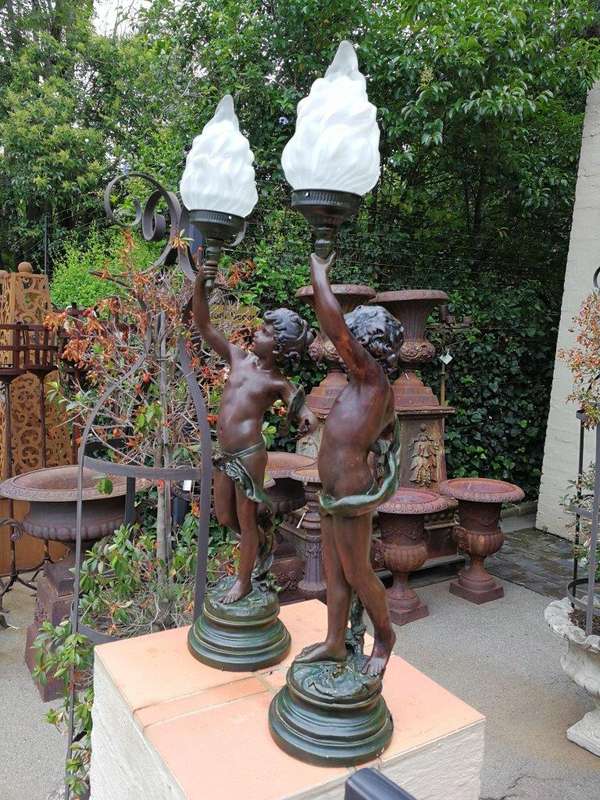 A Pair Of Antique Figural Lamps