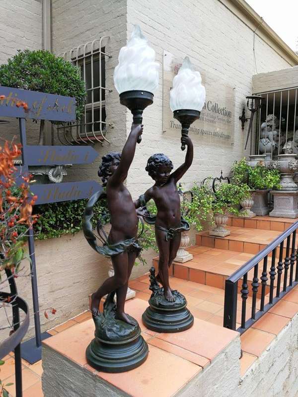 A Pair Of Antique Figural Lamps