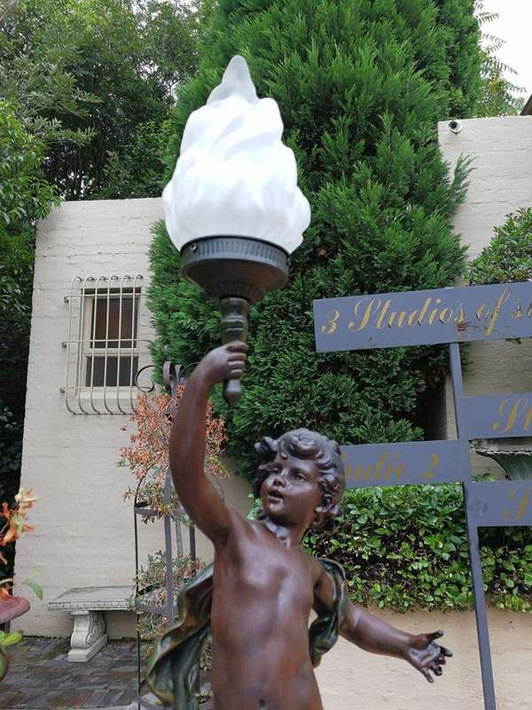 A Pair Of Antique Figural Lamps