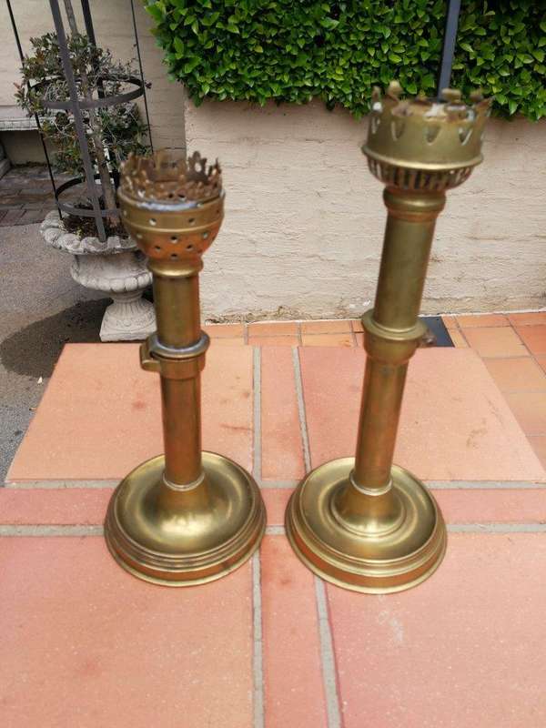 A Set Of Two Ecclesiastical Brass Candlesticks