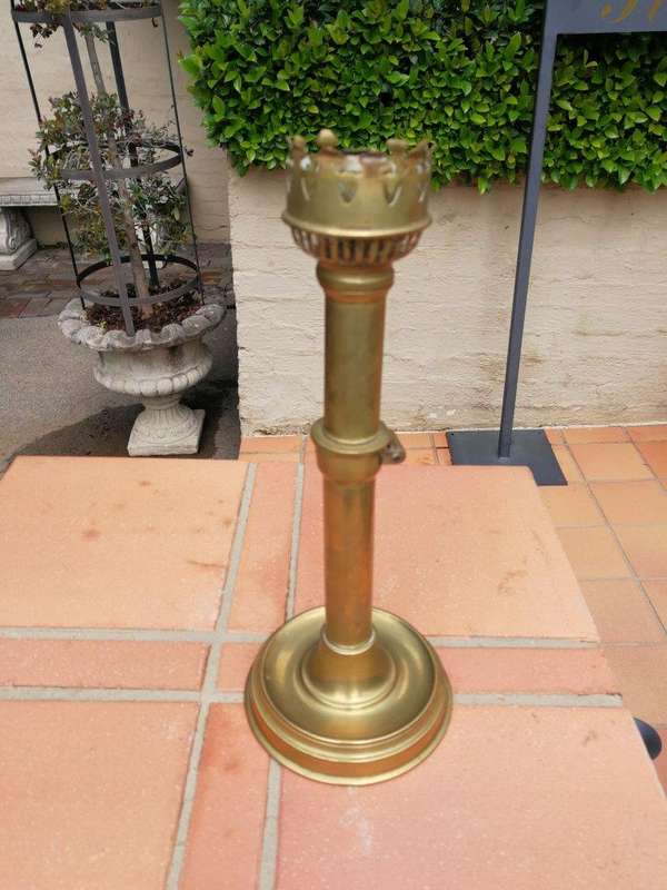 A Set Of Two Ecclesiastical Brass Candlesticks
