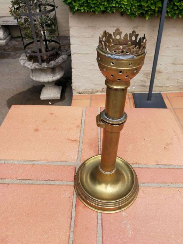 A Set Of Two Ecclesiastical Brass Candlesticks