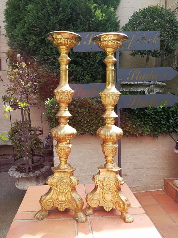 A 20th century pair of brass candleholders/pricket sticks