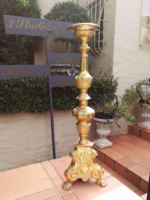 A 20th century pair of brass candleholders/pricket sticks
