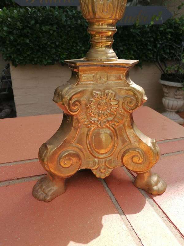 A 20th century pair of brass candleholders/pricket sticks