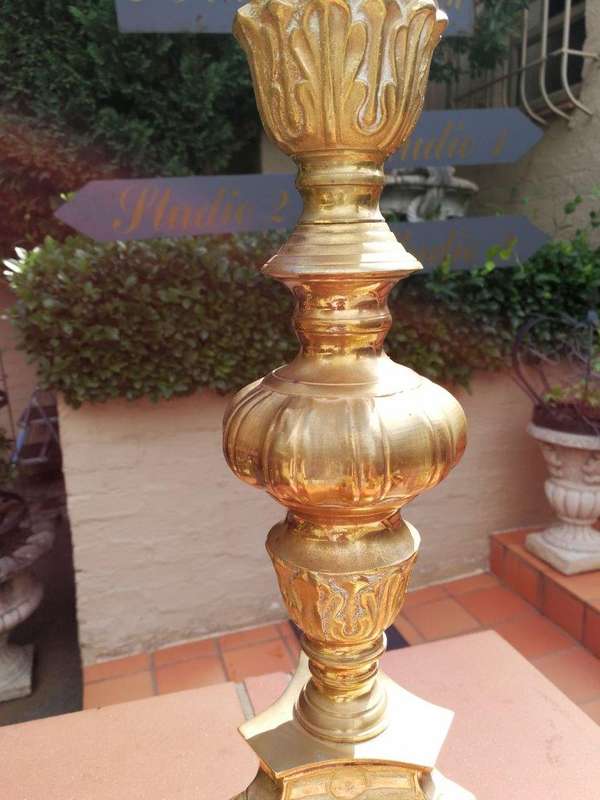 A 20th century pair of brass candleholders/pricket sticks