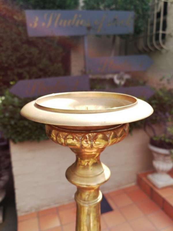 A 20th century pair of brass candleholders/pricket sticks