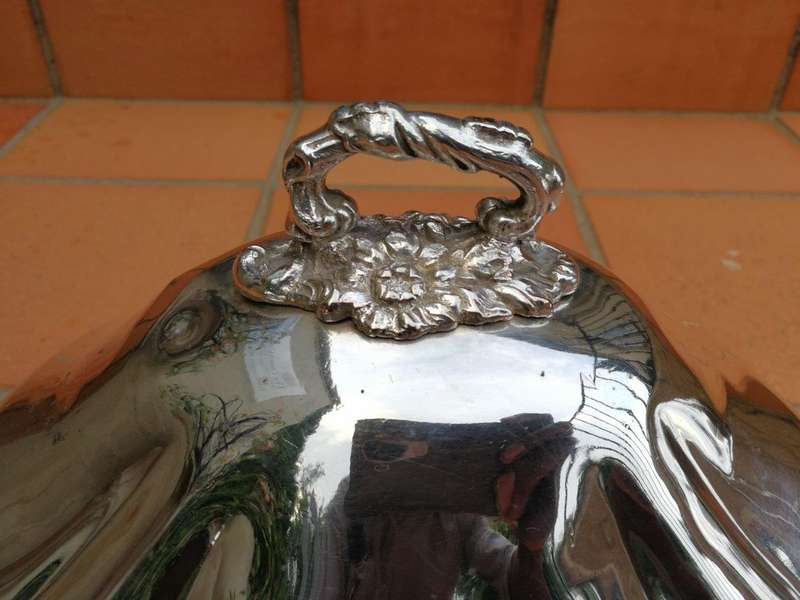 A late 19th century set of four graduated silver-plate food domes ND