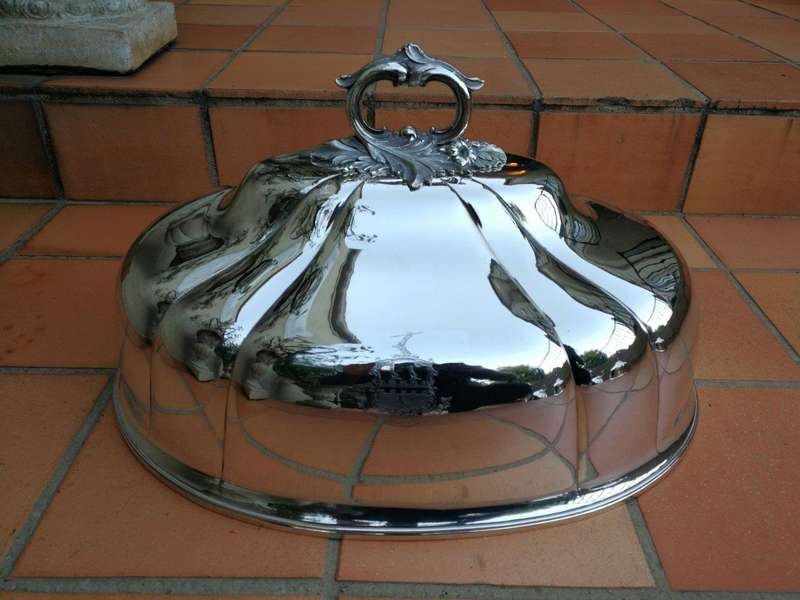 A Set Of Four Silver-Plate Food Domes
