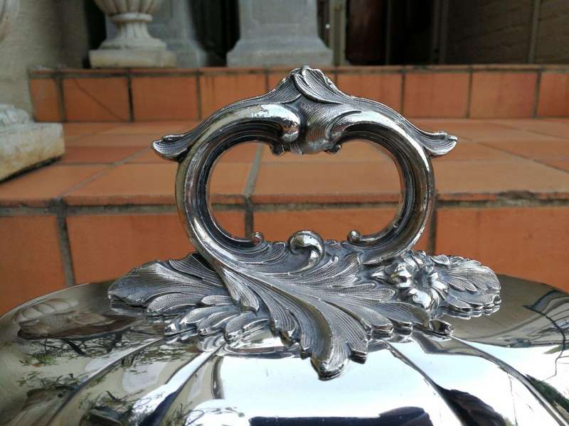 A Set Of Four Silver-Plate Food Domes