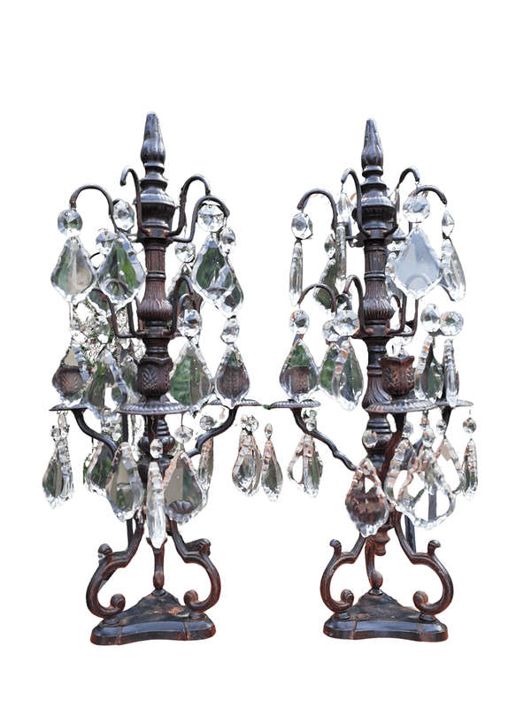 A pair of cast-iron and crystal candelabras