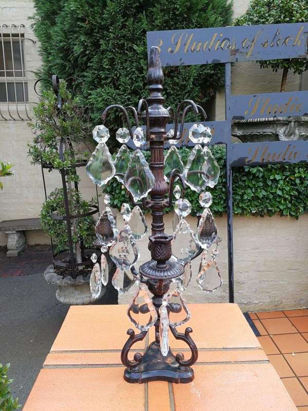 A pair of cast-iron and crystal candelabras