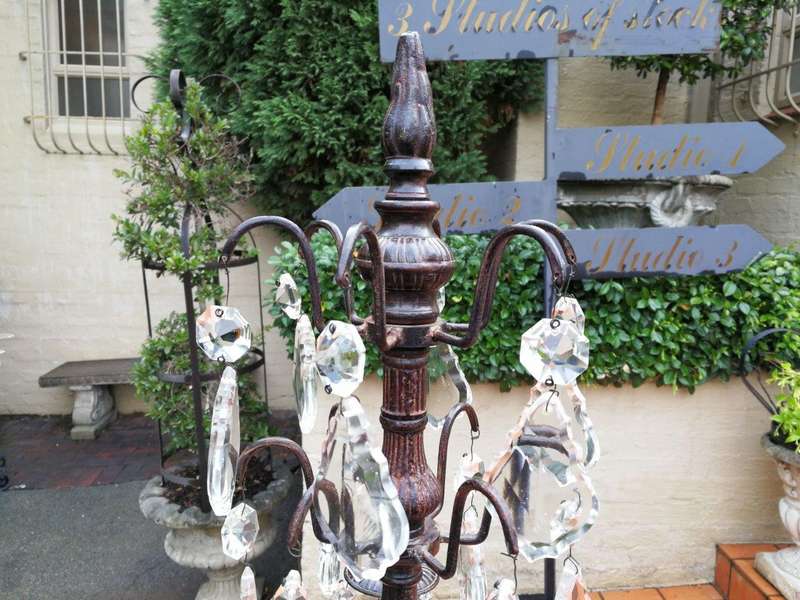 A pair of cast-iron and crystal candelabras