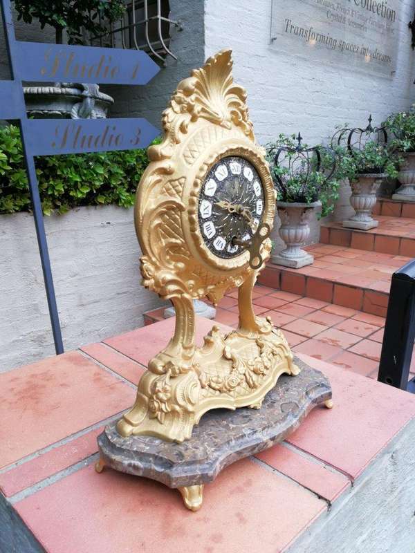 A 19th Century French Gilt Metal Clock in Glass Cloche with Hand Gilded Wooden Base