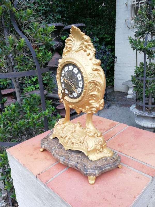 A 19th Century French Gilt Metal Clock in Glass Cloche with Hand Gilded Wooden Base