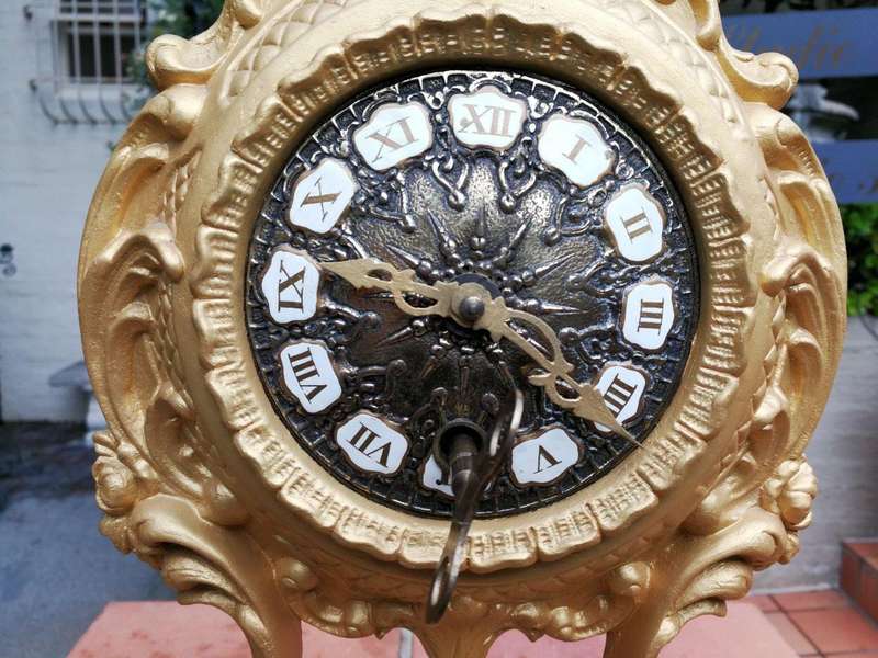 A 19th Century French Gilt Metal Clock in Glass Cloche with Hand Gilded Wooden Base