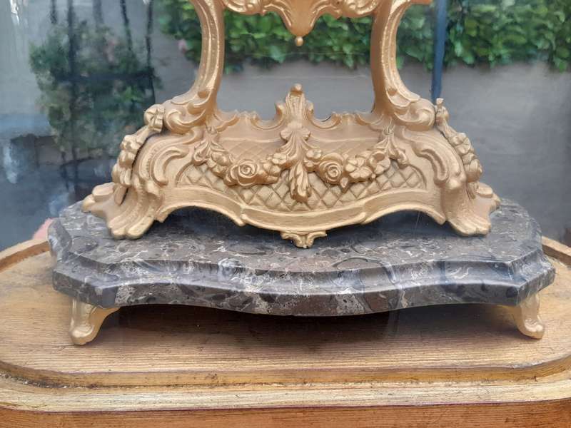 A 19th Century French Gilt Metal Clock in Glass Cloche with Hand Gilded Wooden Base