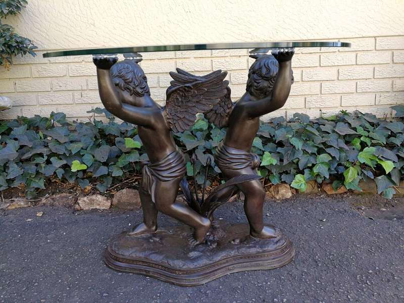 A Large Bronze Cherub Table Base with Glass Top ND