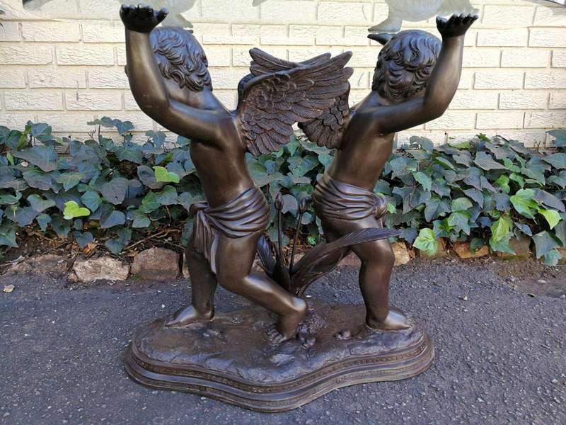 A Large Bronze Cherub Table Base with Glass Top ND