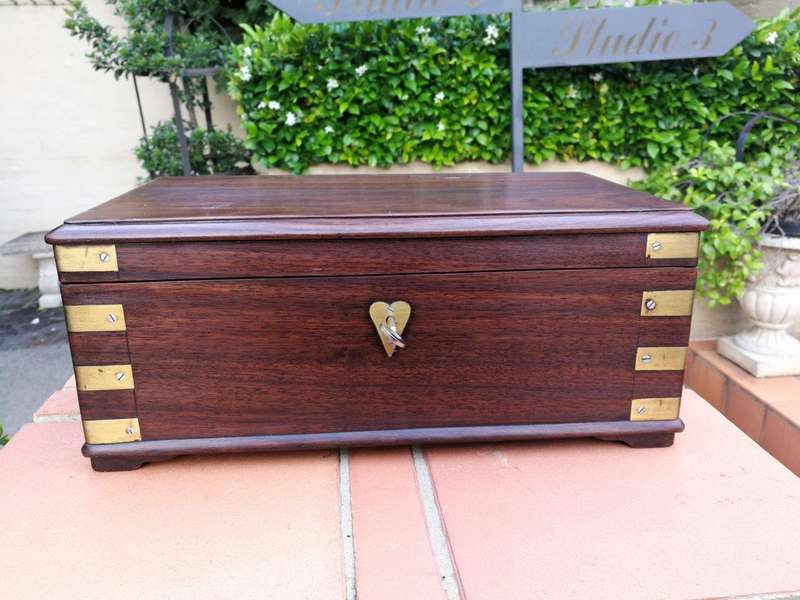 A Mahogany Polished Box With Brass details and Escutcheon and Key